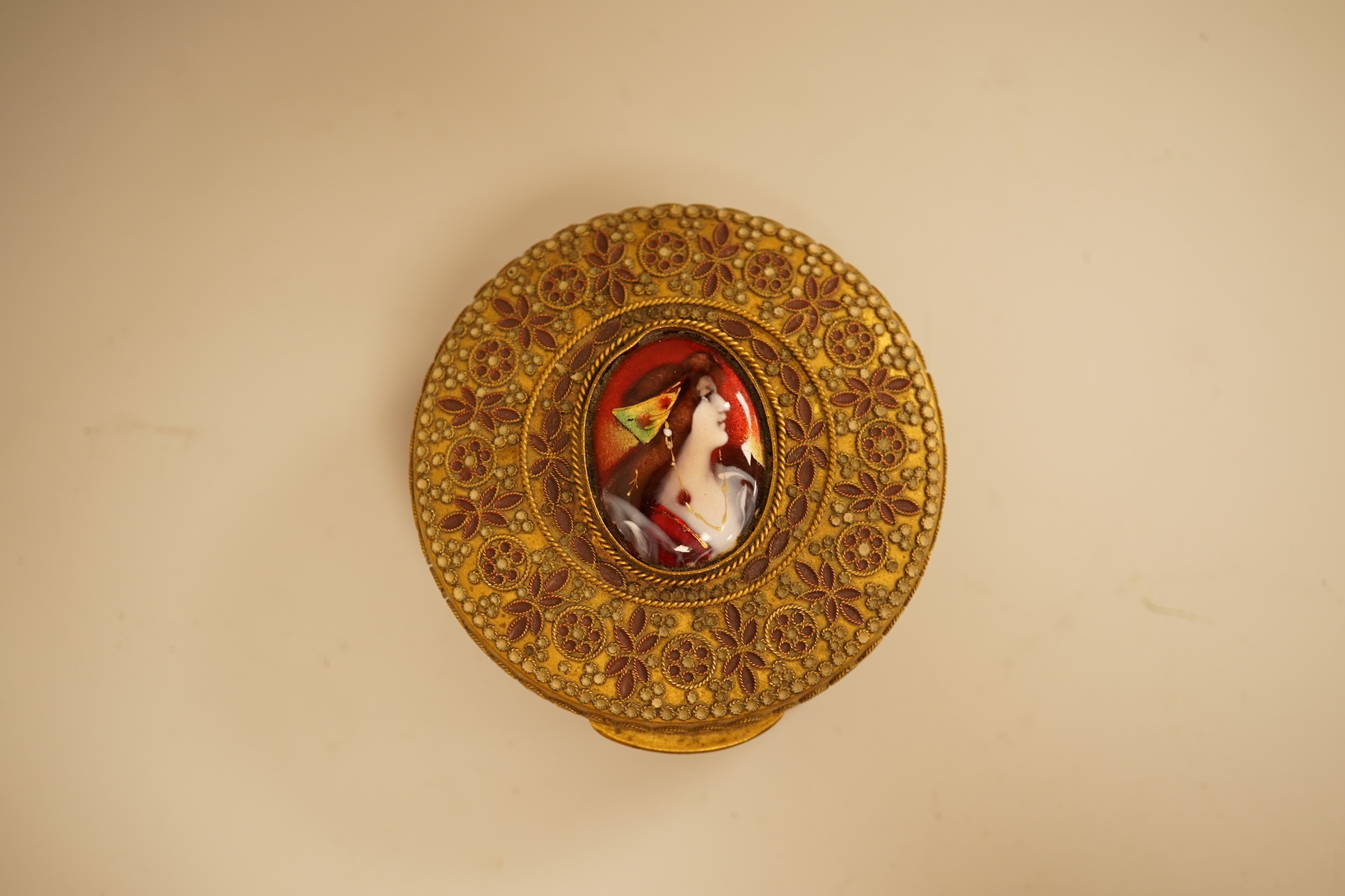 Two Limoges enamel mounted gilt filigree work circular boxes, largest 8cm diameter